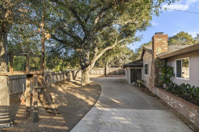 view of yard with a patio area and a fenced backyard