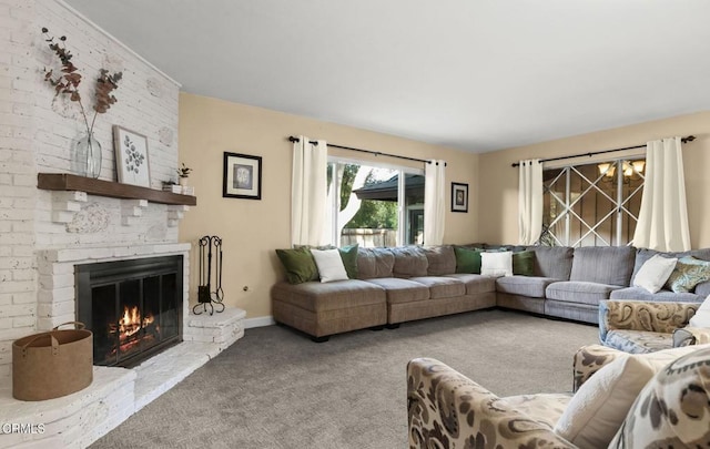 carpeted living area featuring a fireplace and baseboards