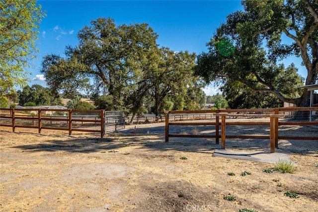 view of gate featuring a rural view