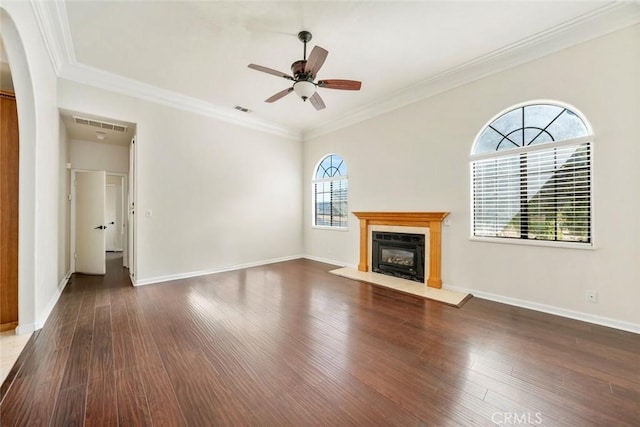 unfurnished living room with ceiling fan, dark hardwood / wood-style flooring, and ornamental molding