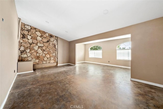 empty room with vaulted ceiling