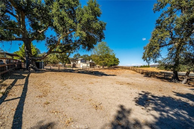 view of yard with a rural view