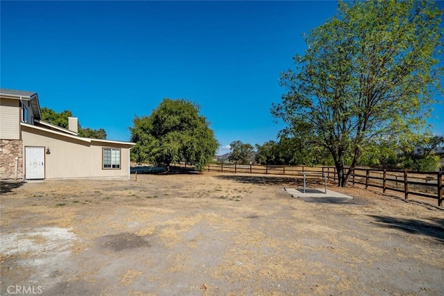 view of yard featuring a rural view