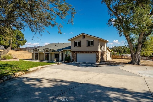 view of front of property with a garage