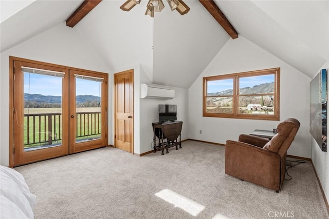 living area with light carpet, a mountain view, ceiling fan, a wall mounted air conditioner, and vaulted ceiling with beams