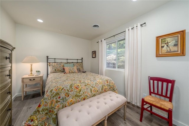 bedroom featuring wood-type flooring