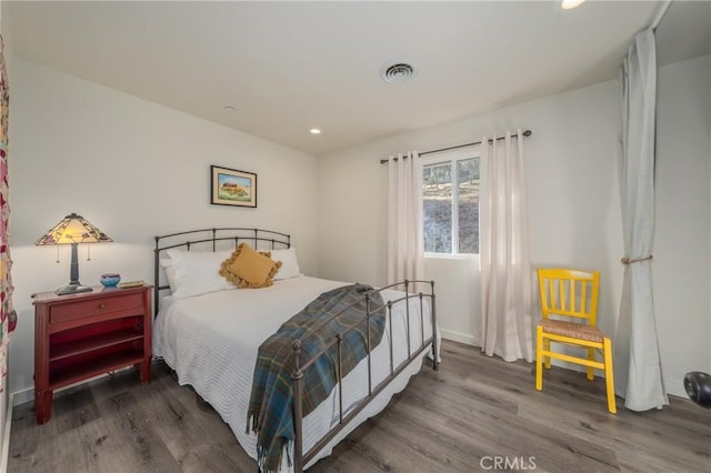 bedroom featuring hardwood / wood-style floors