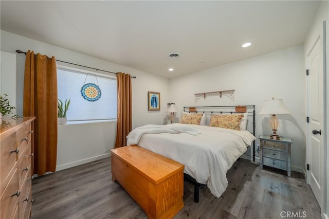 bedroom featuring dark hardwood / wood-style flooring