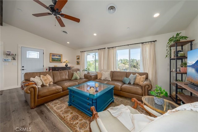 living room featuring vaulted ceiling, ceiling fan, and light hardwood / wood-style floors