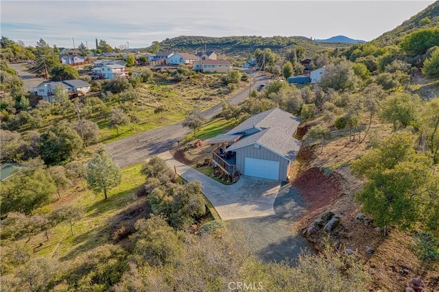 birds eye view of property featuring a mountain view