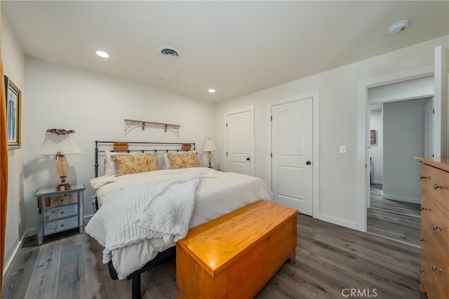 bedroom featuring dark wood-type flooring