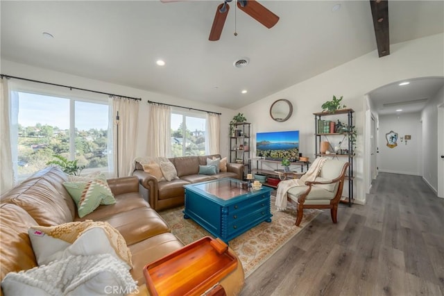 living room with hardwood / wood-style flooring, lofted ceiling with beams, and ceiling fan