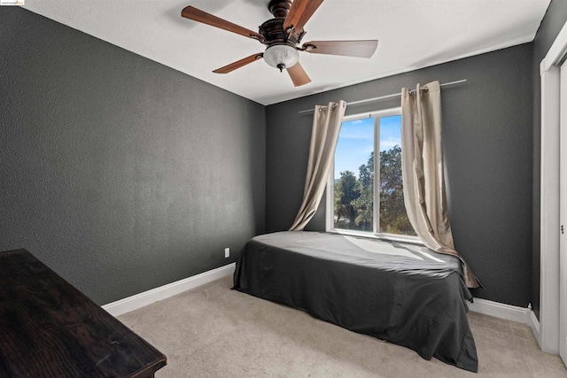 carpeted bedroom with ceiling fan