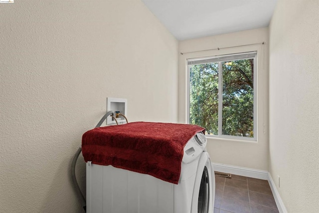 clothes washing area with tile patterned floors and hookup for a washing machine