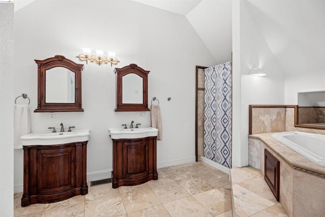 bathroom with vanity and vaulted ceiling