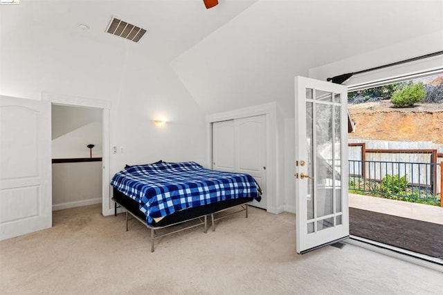 carpeted bedroom featuring vaulted ceiling and ceiling fan