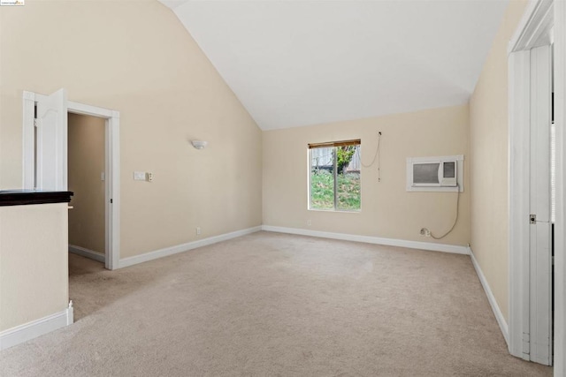 interior space featuring an AC wall unit and high vaulted ceiling