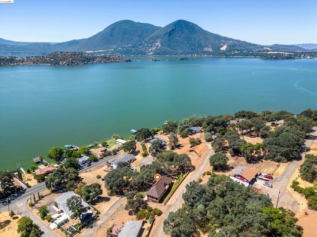 aerial view featuring a water and mountain view