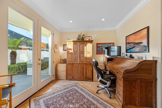 office area featuring french doors, ornamental molding, and light wood-type flooring