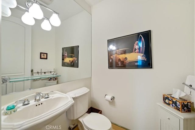 bathroom with sink and toilet