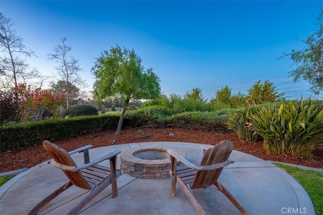 view of patio / terrace with an outdoor fire pit