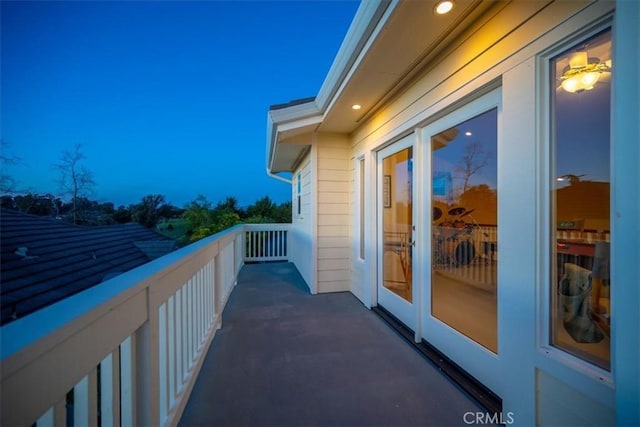 view of balcony at dusk