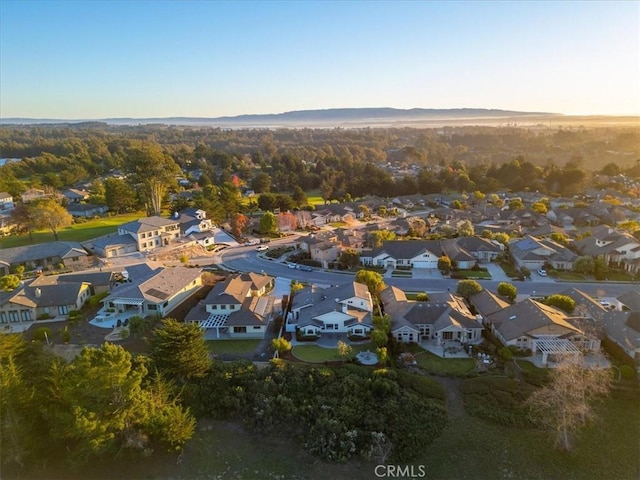 birds eye view of property featuring a mountain view