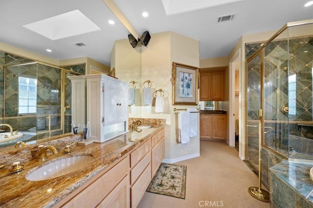 bathroom with vanity, a skylight, and plus walk in shower