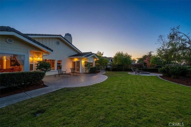 exterior space featuring a yard and a patio area