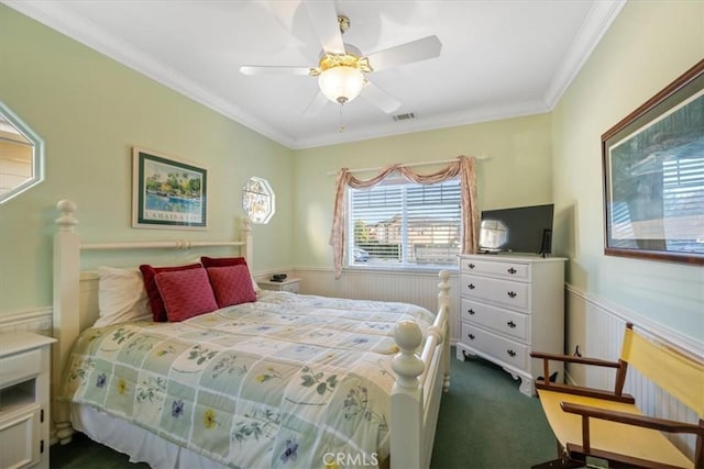 bedroom featuring ornamental molding, ceiling fan, and carpet flooring