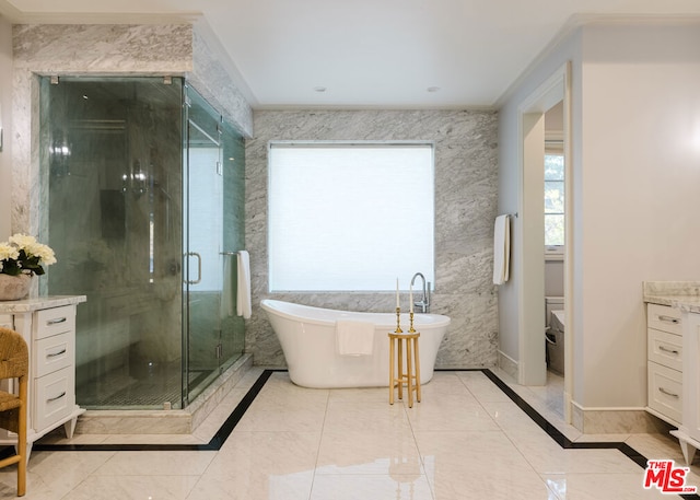 full bathroom featuring toilet, vanity, ornamental molding, and separate shower and tub