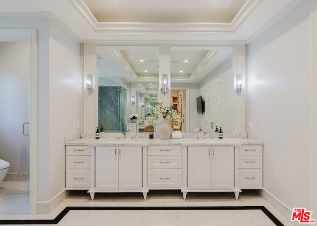 bathroom with a tray ceiling, tile patterned flooring, an enclosed shower, ornamental molding, and vanity