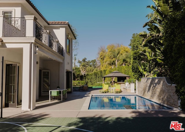 view of pool featuring a patio area and a gazebo