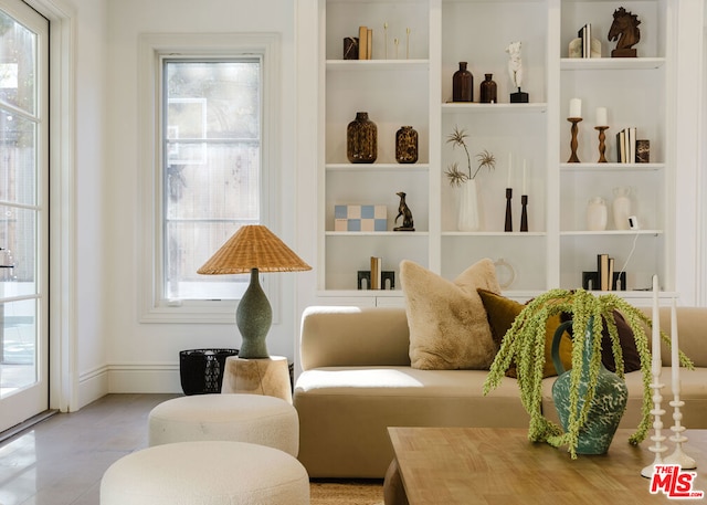 sitting room with built in shelves