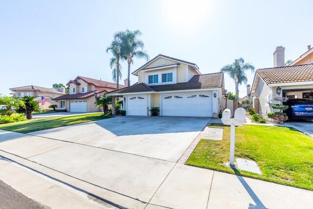 front facade with a garage and a front yard