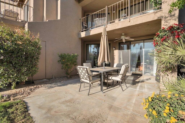 view of patio featuring a balcony and ceiling fan