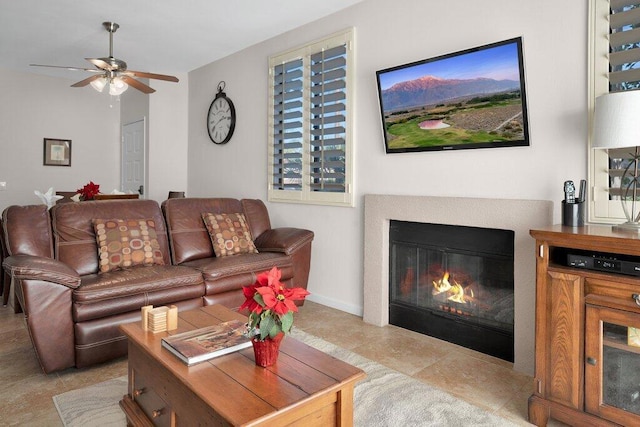 tiled living room featuring ceiling fan