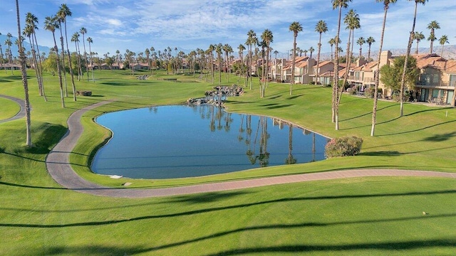 view of community featuring a water view and a yard