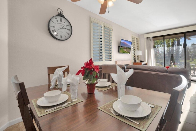 dining space with ceiling fan and hardwood / wood-style floors