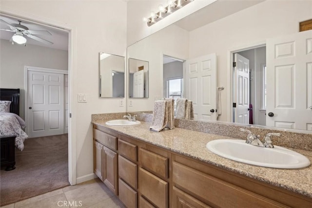 bathroom with ceiling fan, vanity, and tile patterned flooring