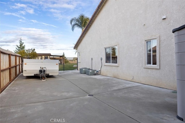 view of home's exterior with a patio area and central air condition unit