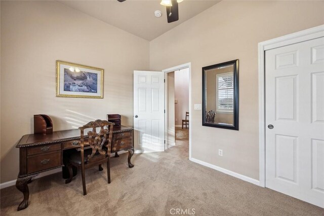 carpeted office featuring ceiling fan and vaulted ceiling