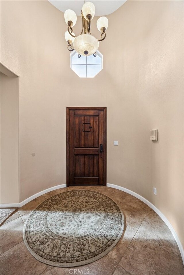 entrance foyer featuring an inviting chandelier