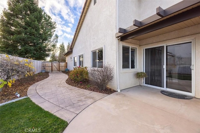 view of side of property featuring a patio area