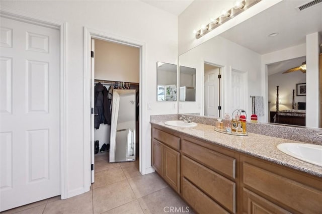 bathroom featuring ceiling fan, vanity, and tile patterned floors