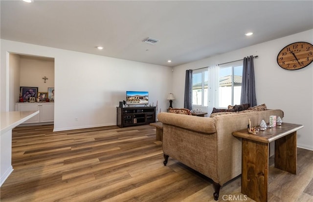 living room with dark hardwood / wood-style flooring