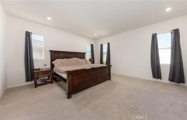 bedroom with light carpet