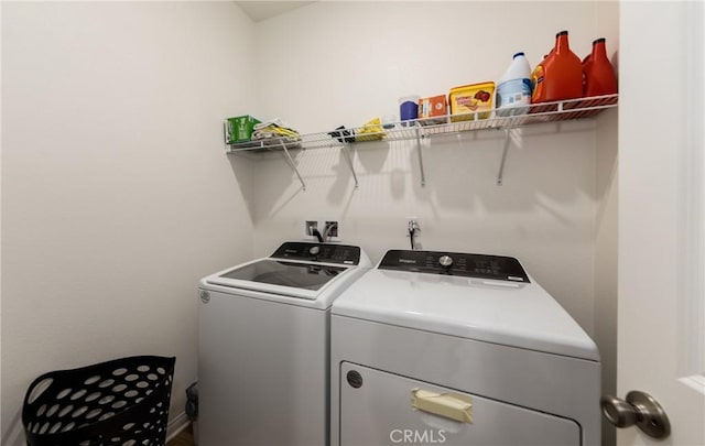 clothes washing area with washer and dryer