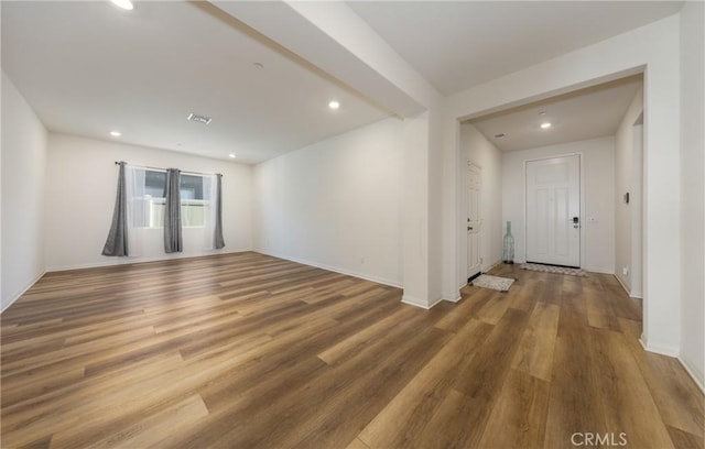 empty room with wood-type flooring