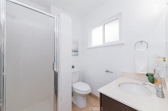 bathroom featuring an enclosed shower, vanity, tile patterned floors, and toilet